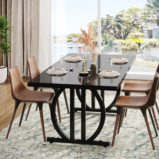 Dining room with a black glass table and brown chairs, set for a meal.