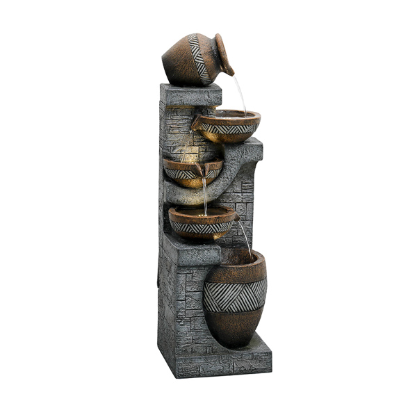 Decorative water fountain with stone-like base and ceramic bowls on a white background