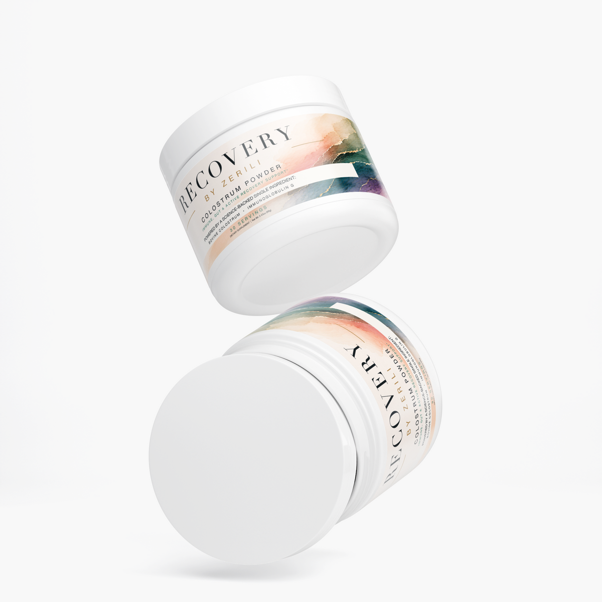 Two white Recovery Colostrum Powder by Zerili jars arranged at an angle on a white background.