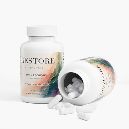 Two Restore by Zerili Daily Probiotic bottles, one open with capsules spilling out.