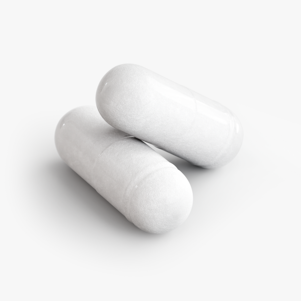 Close-up of two white capsules for Restore by Zerili Daily Probiotic.