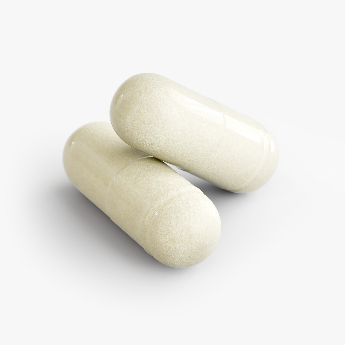 Close-up of two pale capsules for Restore by Zerili Digestive Enzymes.