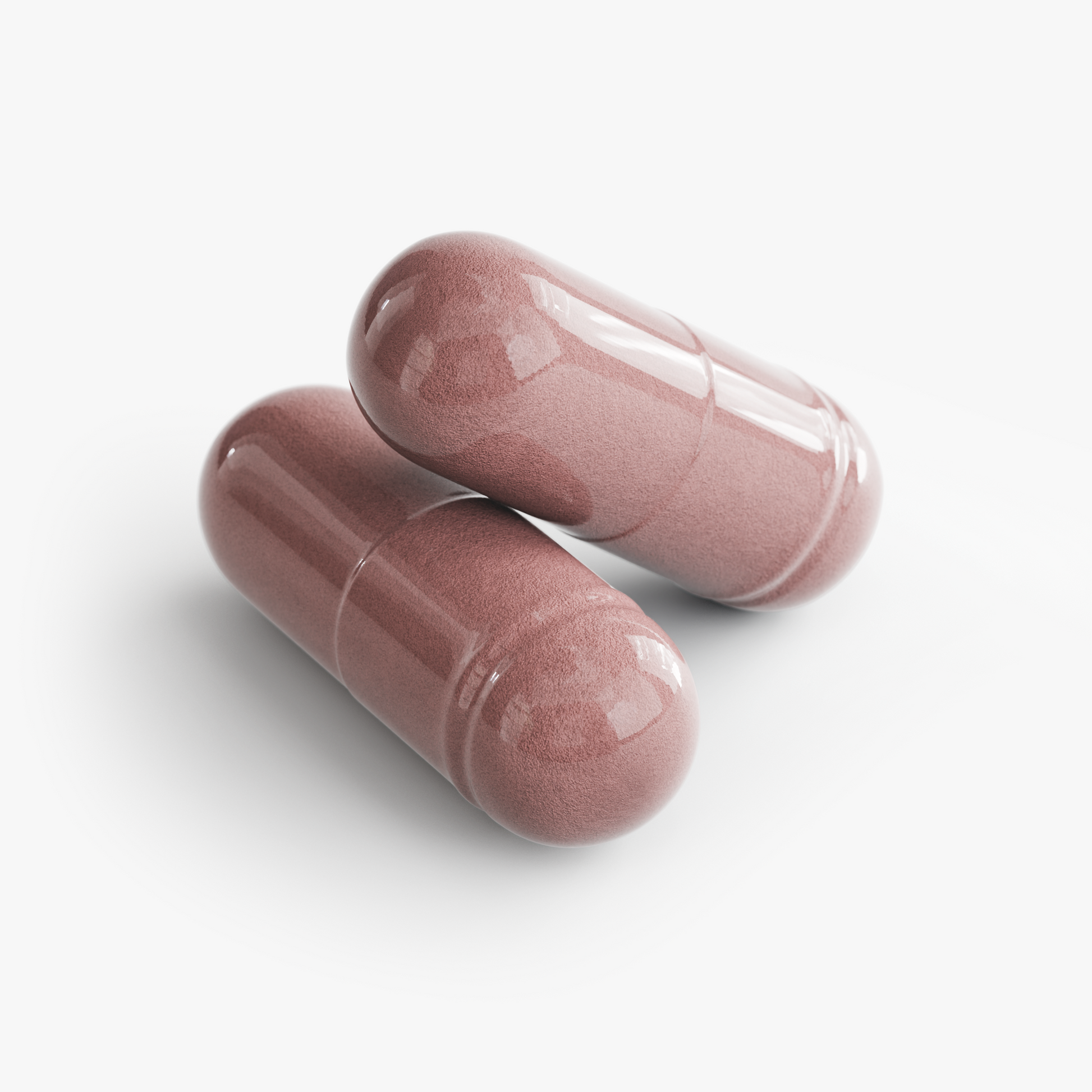 Close-up of two pink capsules for Restore by Zerili Immune Support.