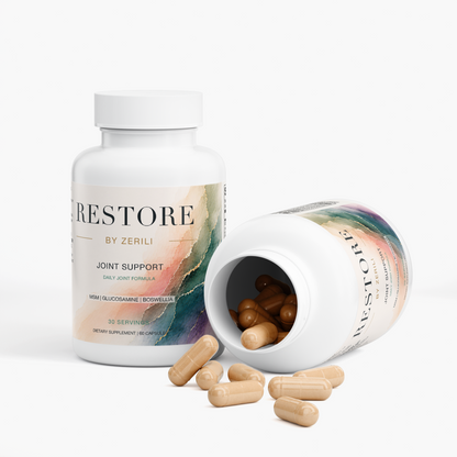 Restore by Zerili Joint Support bottles with one tipped on its side and tan capsules spilling out.